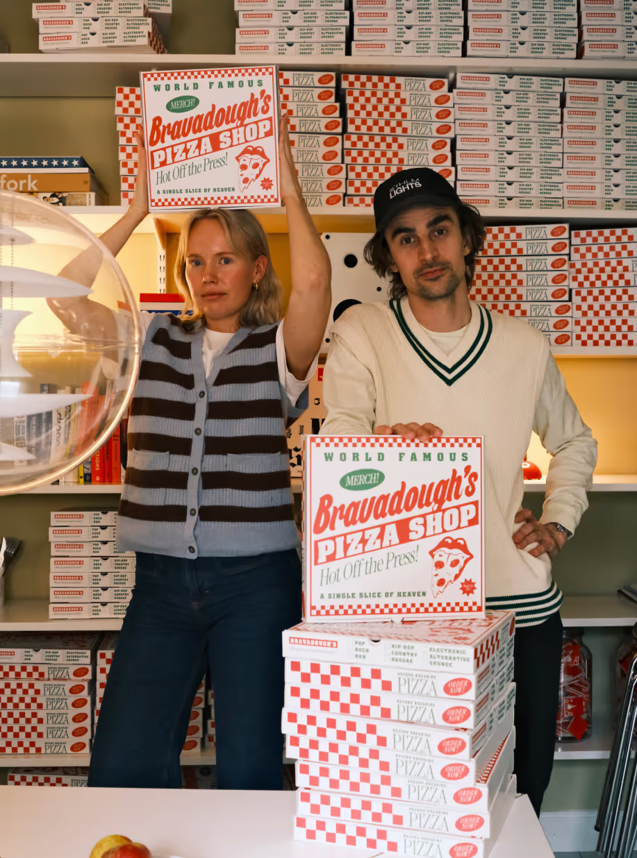 Team Several posing with Designed Pizzaboxes