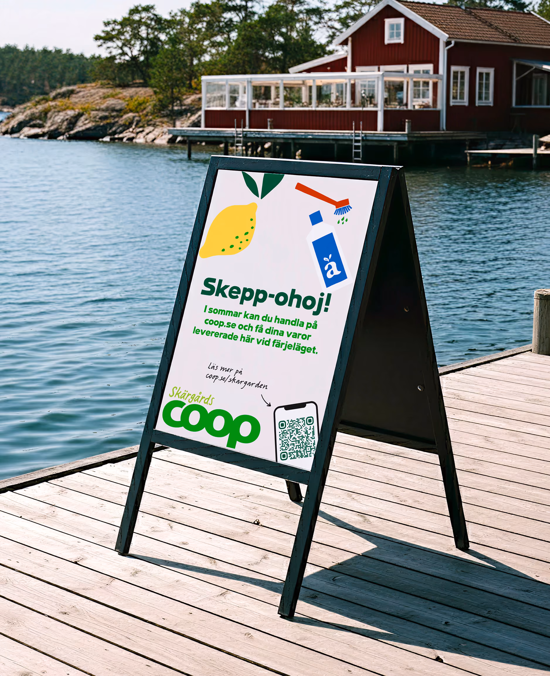 A-frame sign on a jetty reading 'Skepp-ohoj!' promoting Coop Skärgården pier deliveries