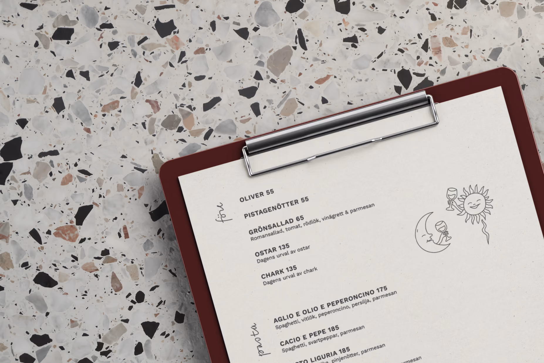 Cucina Povera menu on a clipboard lying on a terrazzo table