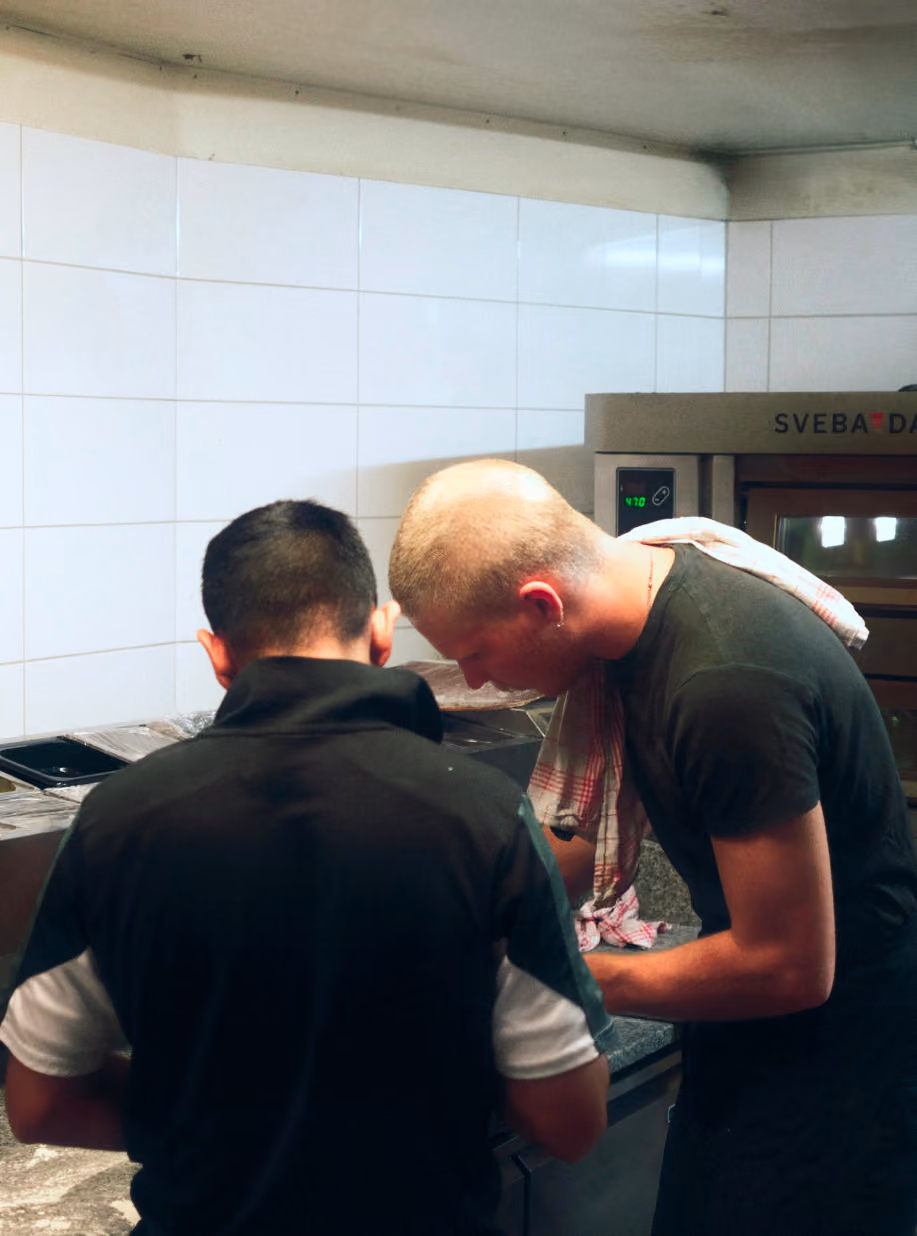Two chefs at work in the Cucina Povera kitchen