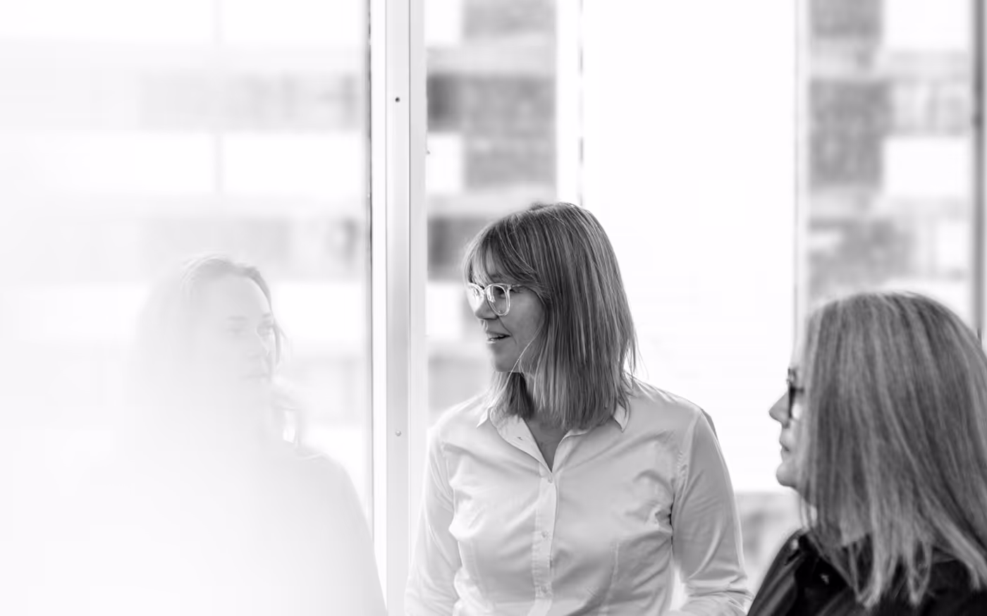 Three Stelly founders in conversation, in black and white