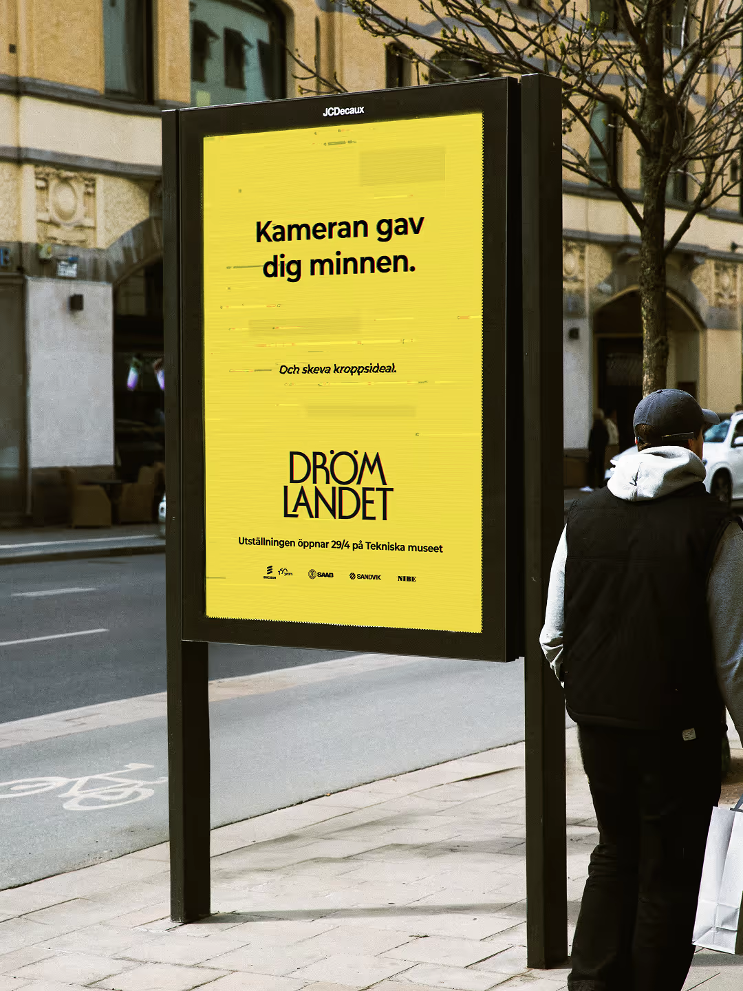 Drömlandet city board on a Stockholm street, announcing the opening on 29 April